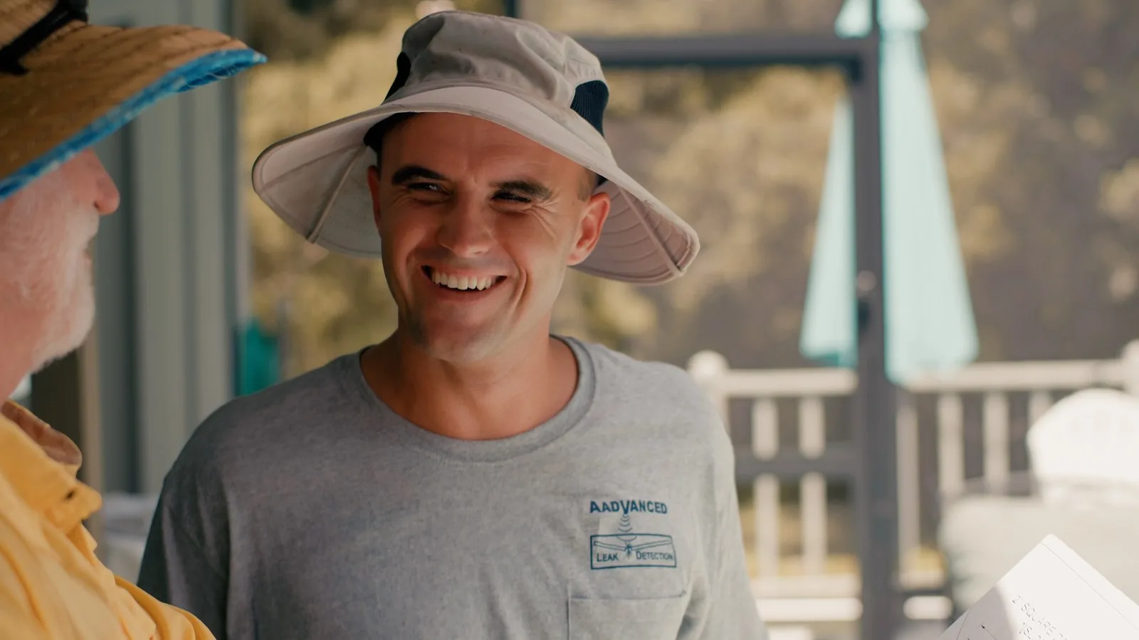 Smiling Advanced Leak Detection technician at a Tampa Bay pool