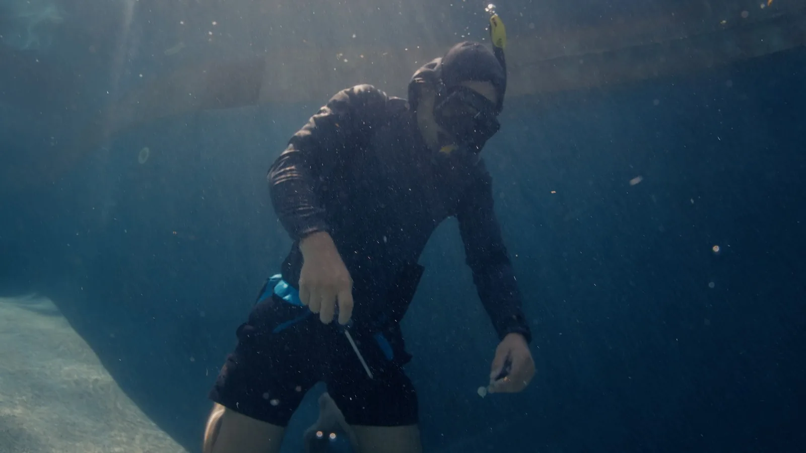 Advanced Leak Detection diver working underwater during a pool leak inspection in Sarasota