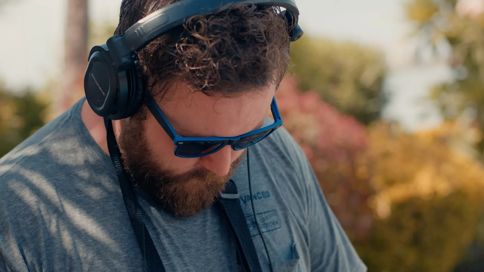 Leak detection technician wearing acoustic headphones to listen for a hidden pool plumbing leak in Sarasota